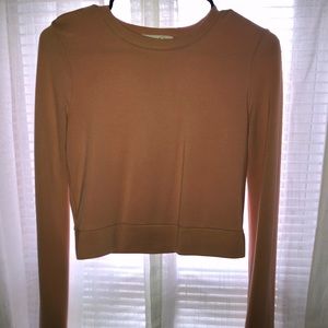 Salmon colored long sleeve crop top